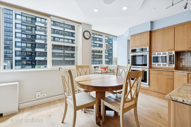 40 E Cedar St Unit 8Cd, Chicago, IL 60611 - dining area featuring plenty of natural light, light wood finished floors, recessed lighting, and baseboard heating