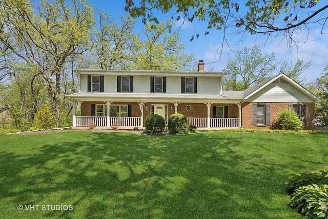 5808 Amherst Ct, Mchenry, IL 60050 - view of front of property featuring a chimney, brick siding, covered porch, and a front yard