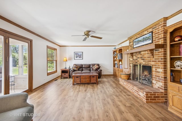 5808 Amherst Ct, Mchenry, IL 60050 - living area with baseboards, crown molding, a ceiling fan, light wood-style flooring, and a brick fireplace