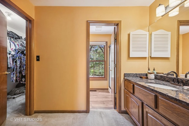 5808 Amherst Ct, Mchenry, IL 60050 - full bathroom with vanity, a spacious closet, and baseboards