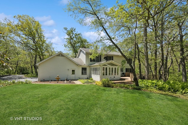 5808 Amherst Ct, Mchenry, IL 60050 - back of house with a lawn, a sunroom, and roof with shingles