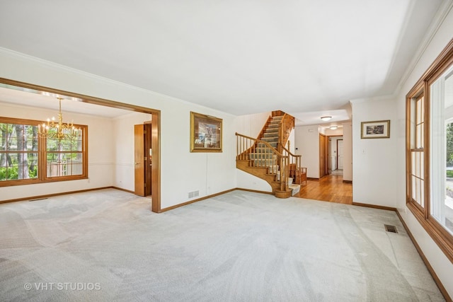 5808 Amherst Ct, Mchenry, IL 60050 - unfurnished living room with carpet, a chandelier, stairway, baseboards, and crown molding