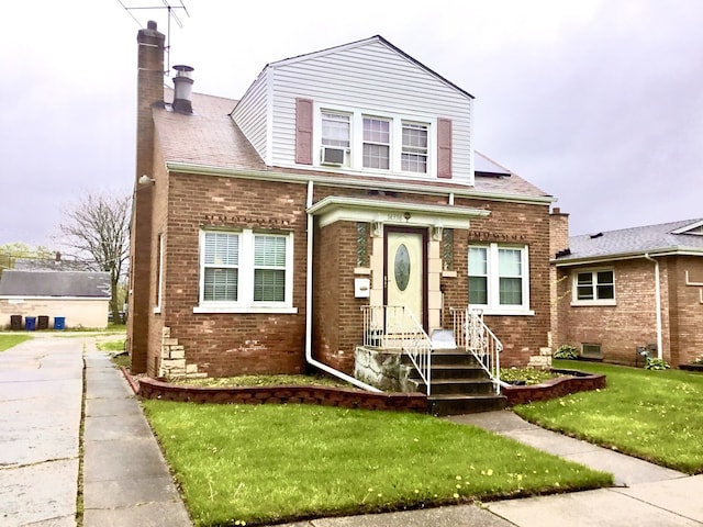 14336 S Harrison Ave, Posen, IL 60469 - view of front of house with brick siding, a chimney, and a front yard