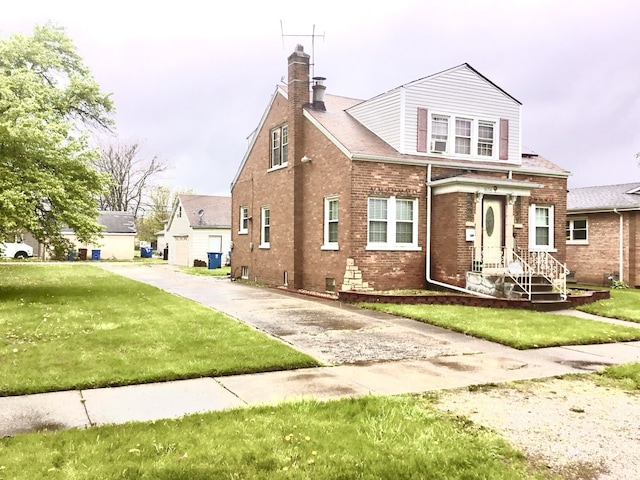 14336 S Harrison Ave, Posen, IL 60469 - view of front of property with brick siding, a chimney, and a front yard