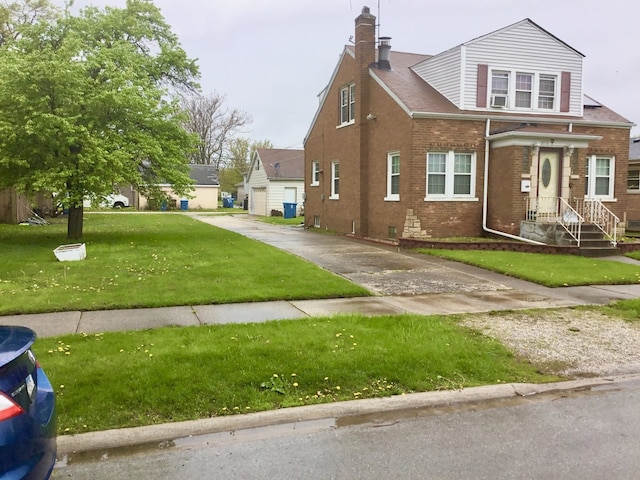 14336 S Harrison Ave, Posen, IL 60469 - view of front facade featuring brick siding, a chimney, and a front yard