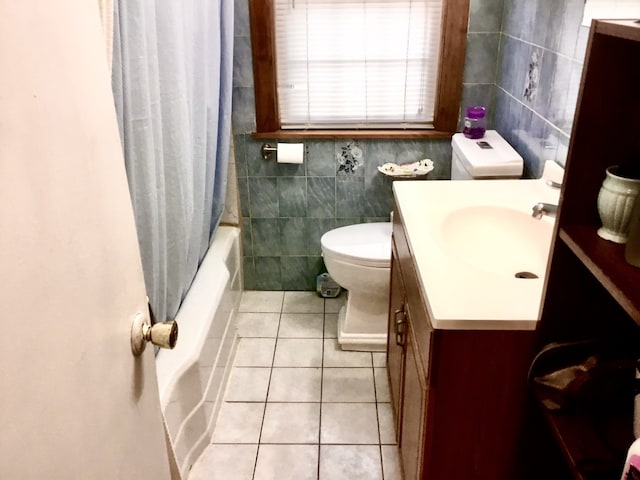 14336 S Harrison Ave, Posen, IL 60469 - full bathroom with toilet, vanity, tile walls, tile patterned flooring, and shower / bath combo with shower curtain