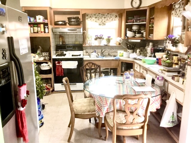 14336 S Harrison Ave, Posen, IL 60469 - kitchen with gas range oven, stainless steel fridge with ice dispenser, decorative backsplash, and light countertops