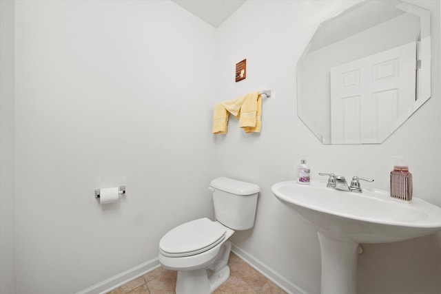 217 Owen St, Matteson, IL 60443 - half bathroom with baseboards, toilet, a sink, and tile patterned floors