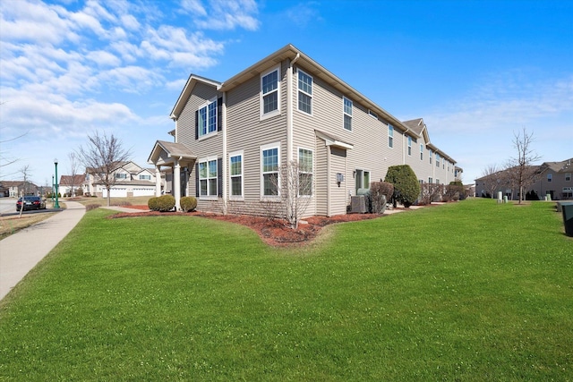 217 Owen St, Matteson, IL 60443 - view of side of home with a yard and central AC unit