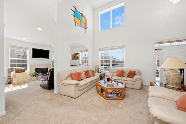 217 Owen St, Matteson, IL 60443 - living room with carpet flooring, a glass covered fireplace, a towering ceiling, and baseboards