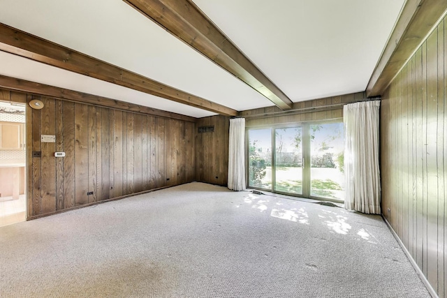 915 Pontiac Rd, Wilmette, IL 60091 - unfurnished living room with beamed ceiling, wood walls, and carpet flooring