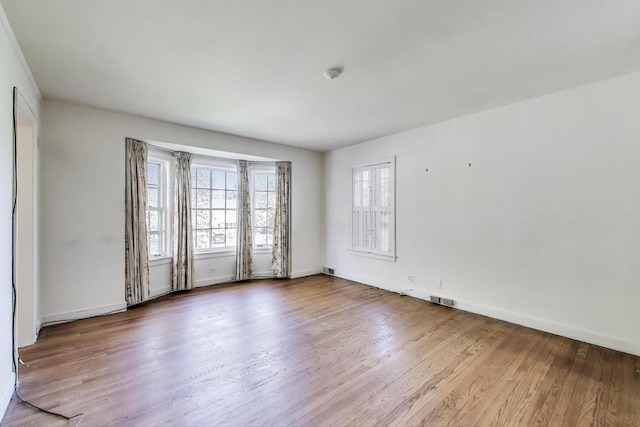915 Pontiac Rd, Wilmette, IL 60091 - empty room with wood finished floors and baseboards