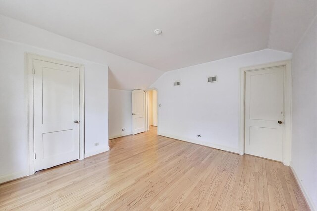 915 Pontiac Rd, Wilmette, IL 60091 - additional living space with lofted ceiling, light wood-type flooring, and baseboards