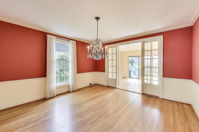 915 Pontiac Rd, Wilmette, IL 60091 - unfurnished room featuring hardwood / wood-style flooring, a chandelier, crown molding, and baseboards