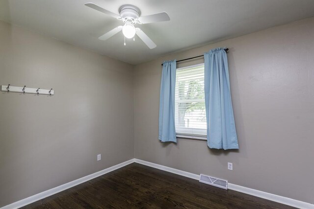 916 Wilson Ct, Zion, IL 60099 - unfurnished room with dark wood finished floors and ceiling fan