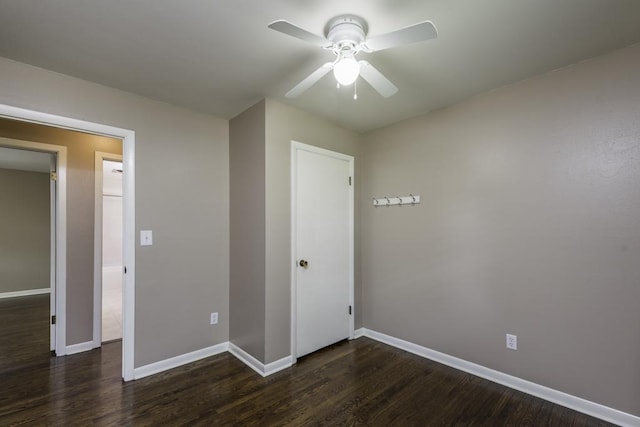 916 Wilson Ct, Zion, IL 60099 - unfurnished bedroom with dark wood-type flooring and ceiling fan