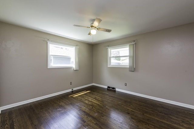 916 Wilson Ct, Zion, IL 60099 - empty room featuring ceiling fan and dark wood-style floors