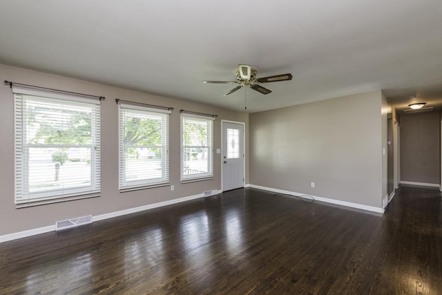 916 Wilson Ct, Zion, IL 60099 - spare room featuring ceiling fan and dark wood finished floors