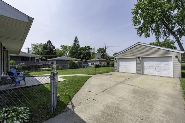 916 Wilson Ct, Zion, IL 60099 - view of yard with an outdoor structure and a detached garage