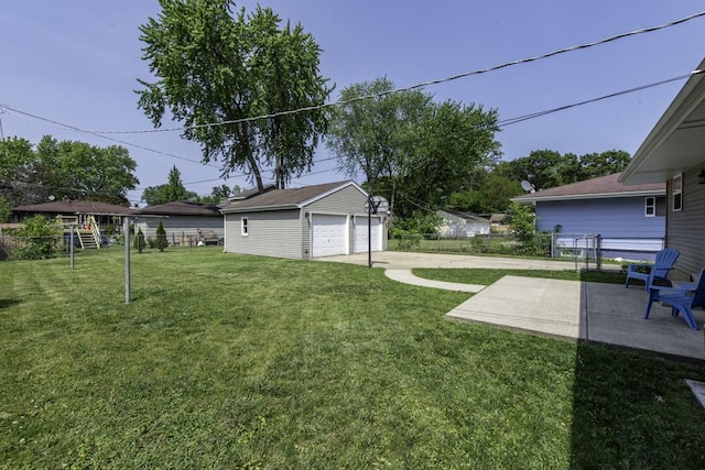 916 Wilson Ct, Zion, IL 60099 - view of yard featuring a garage, an outbuilding, and a patio