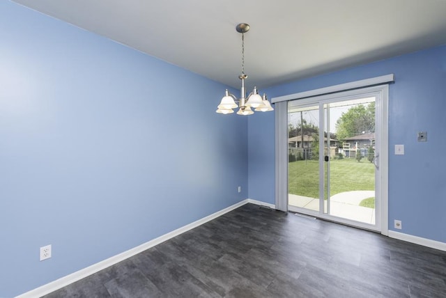 916 Wilson Ct, Zion, IL 60099 - empty room with a chandelier and dark wood-style floors