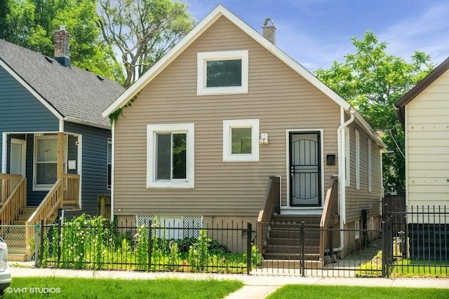 1505 E 76th Pl, Chicago, IL 60619 - bungalow-style home featuring a fenced front yard and a chimney