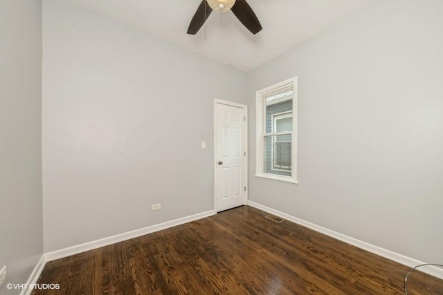 1505 E 76th Pl, Chicago, IL 60619 - spare room featuring dark wood-style flooring and ceiling fan