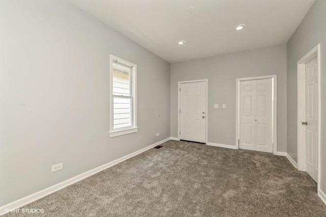 1505 E 76th Pl, Chicago, IL 60619 - unfurnished bedroom featuring carpet and recessed lighting