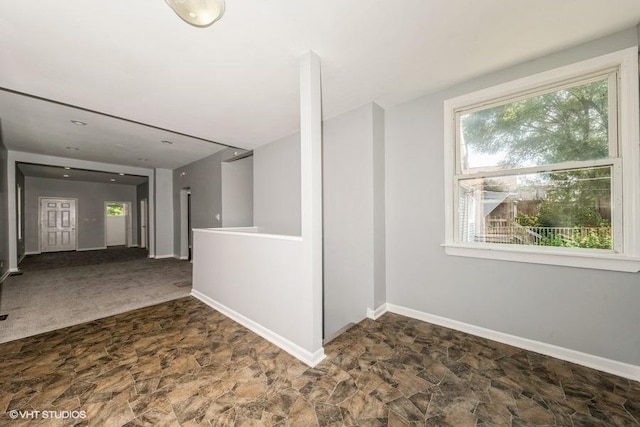 1505 E 76th Pl, Chicago, IL 60619 - unfurnished room featuring healthy amount of natural light and stone finish flooring