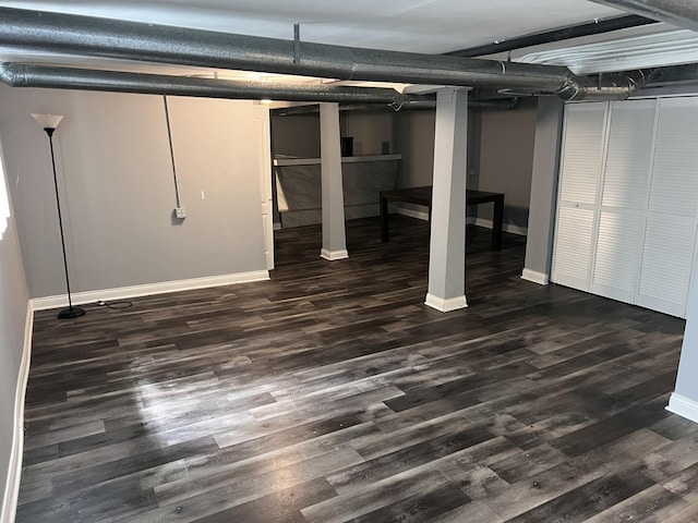 7949 S Manistee Ave, Chicago, IL 60617 - finished below grade area with baseboards and dark wood-style floors