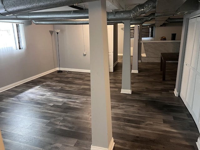 7949 S Manistee Ave, Chicago, IL 60617 - basement with wood finished floors, baseboards, and bar area