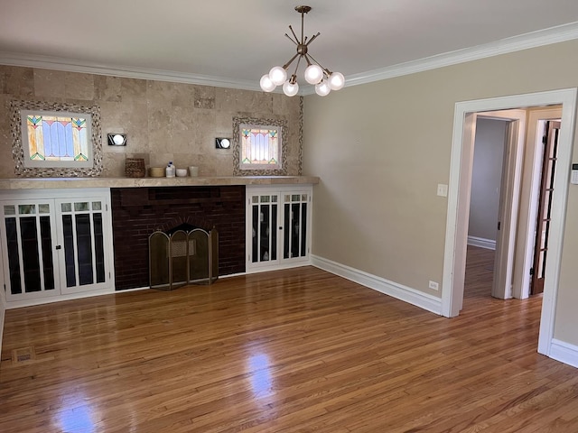 7949 S Manistee Ave, Chicago, IL 60617 - unfurnished living room featuring ornamental molding, wood finished floors, baseboards, a chandelier, and a brick fireplace