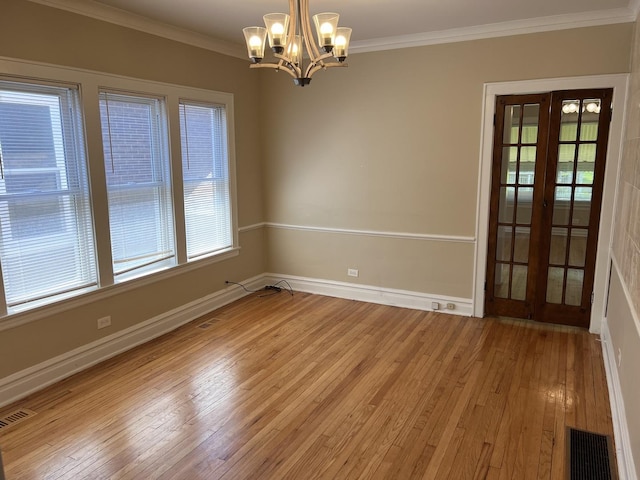 7949 S Manistee Ave, Chicago, IL 60617 - spare room with a chandelier, light wood-style floors, ornamental molding, baseboards, and french doors