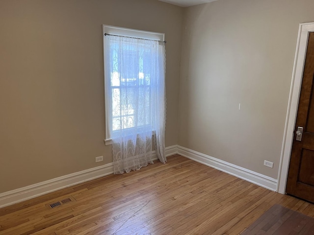 7949 S Manistee Ave, Chicago, IL 60617 - spare room featuring light wood-style flooring and baseboards