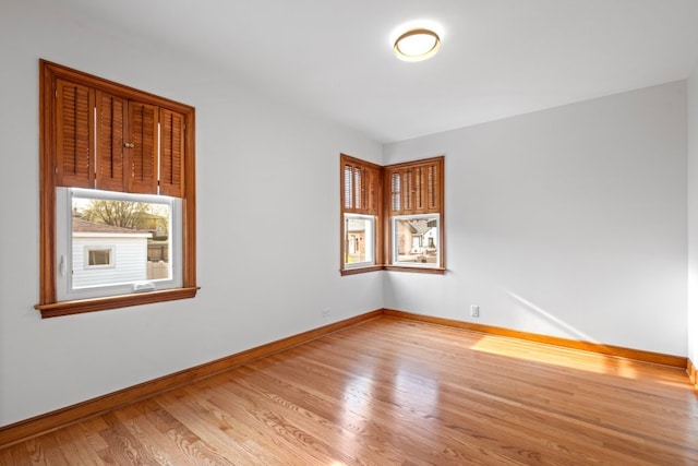 2934 Maple Ave, Berwyn, IL 60402 - spare room featuring baseboards and wood finished floors