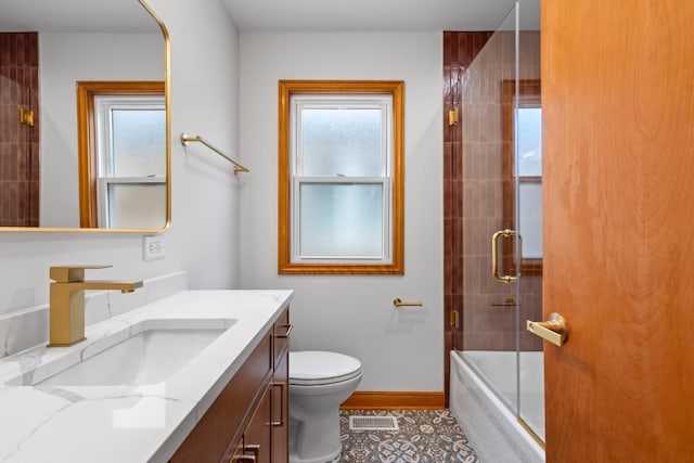 2934 Maple Ave, Berwyn, IL 60402 - full bathroom featuring vanity, toilet, shower / bath combination with glass door, and baseboards