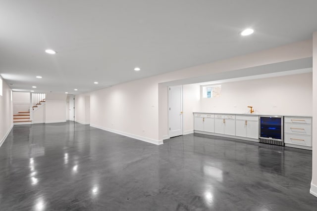 2934 Maple Ave, Berwyn, IL 60402 - unfurnished living room featuring beverage cooler, baseboards, bar area, and recessed lighting