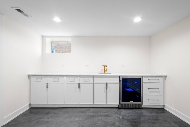 2934 Maple Ave, Berwyn, IL 60402 - bar area with beverage cooler, concrete flooring, baseboards, recessed lighting, and a sink