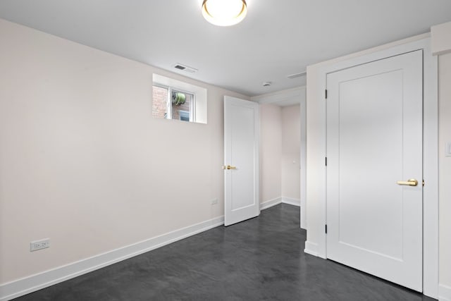 2934 Maple Ave, Berwyn, IL 60402 - unfurnished bedroom featuring finished concrete floors and baseboards