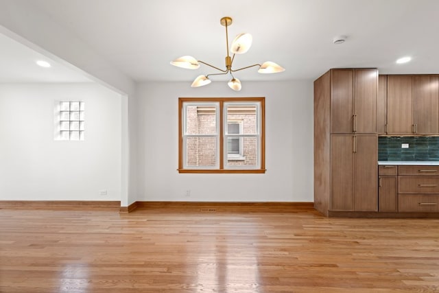 2934 Maple Ave, Berwyn, IL 60402 - unfurnished dining area featuring a chandelier, light wood-type flooring, baseboards, and recessed lighting