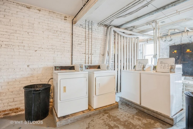50 Forest Ave Unit 3S, Riverside, IL 60546 - laundry room featuring washing machine and clothes dryer and brick wall