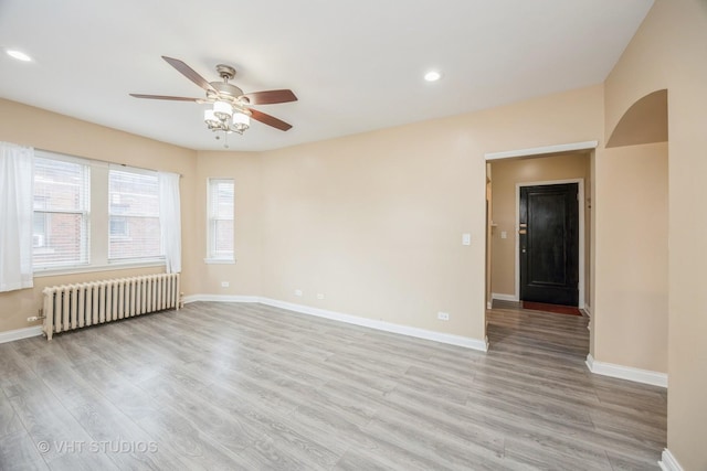 50 Forest Ave Unit 3S, Riverside, IL 60546 - spare room featuring radiator heating unit, ceiling fan, light wood-style floors, baseboards, and recessed lighting