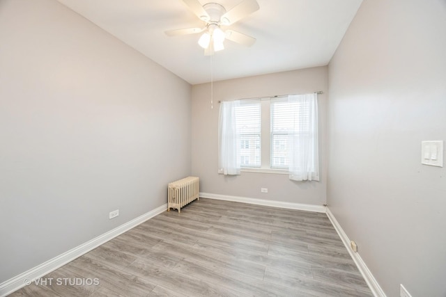 50 Forest Ave Unit 3S, Riverside, IL 60546 - spare room featuring radiator heating unit, light wood-style flooring, ceiling fan, and baseboards