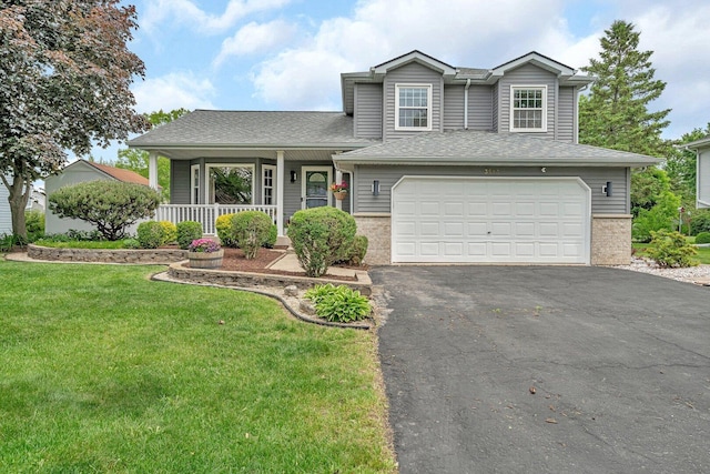 3513 Harris Dr, Joliet, IL 60431 - split level home featuring asphalt driveway, a porch, a front yard, a garage, and roof with shingles