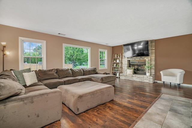 3513 Harris Dr, Joliet, IL 60431 - living room featuring wood finished floors and a fireplace