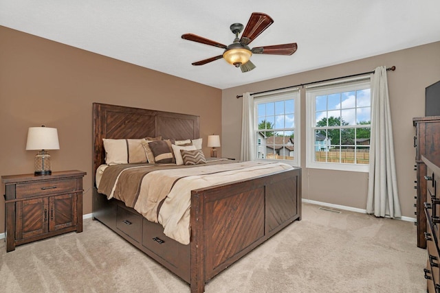 3513 Harris Dr, Joliet, IL 60431 - bedroom featuring baseboards, light carpet, and a ceiling fan