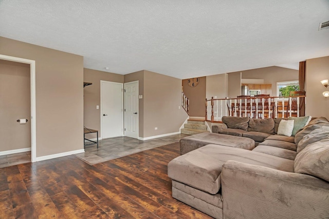 3513 Harris Dr, Joliet, IL 60431 - living area featuring wood finished floors, stairway, baseboards, and a textured ceiling