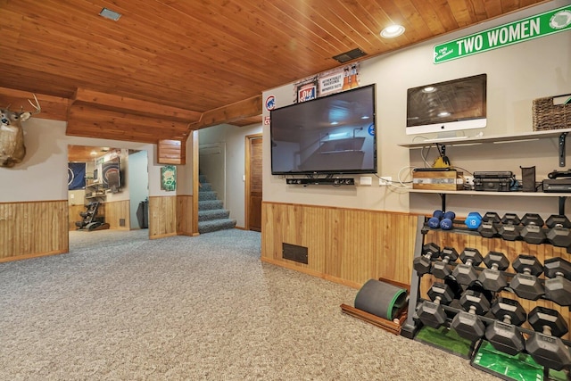 3513 Harris Dr, Joliet, IL 60431 - carpeted living area with wainscoting, wooden ceiling, wooden walls, and stairway