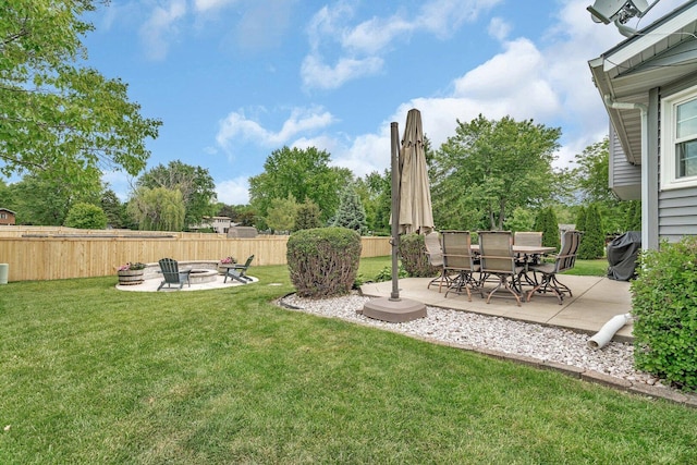 3513 Harris Dr, Joliet, IL 60431 - view of yard featuring a fire pit and a patio area