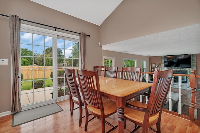 3513 Harris Dr, Joliet, IL 60431 - dining space with light wood finished floors, vaulted ceiling, and baseboards